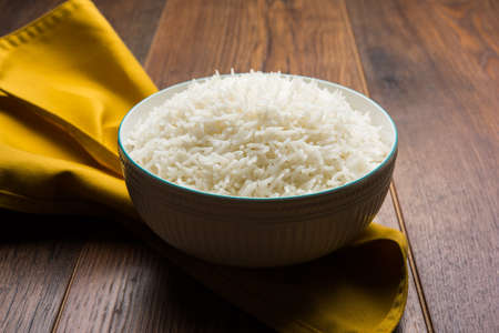 basmati rice in a ceramic bowl, indian white and long basmati rice cooked and served in bowl, selective focusの写真素材