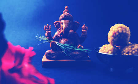 Happy Ganesh Chaturthi Greeting Card showing photograph of lord ganesha idol, pooja or puja thali,...