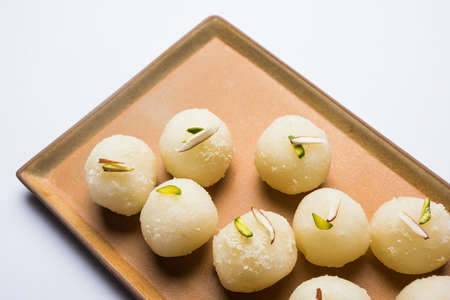 Stock Photo of Rasgulla or sponge Ras Gulla, It is made from ball shaped dumplings of chhena and semolina dough, cooked in light syrup made of sugar.の写真素材