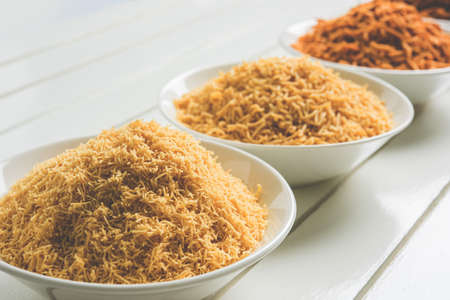 stock photo of Sev Namkeen Food Collection Aloo Sev also know as namkin and nimco a popular crisp savory snack made from mashed potatoes, chickpea flour and spicesの写真素材