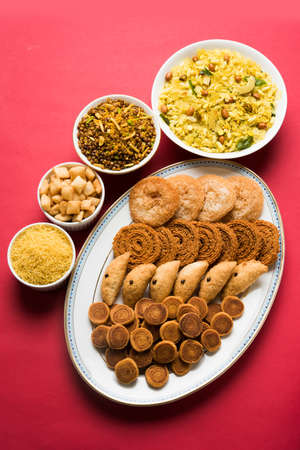stock photo of  Diwali food or Diwali snacks or Diwali sweets like anarsa, bakarvadi, chakli, sev, bhujiya, shankar pale and chivda or chiwada, karanji, favourite indian diwali recipe, selective focusの写真素材