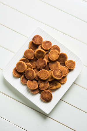 Stock Photo of Indian Fried Bhakarwadi Tea Time Snack also known as bakarwadi, bakarvadi, bakar...