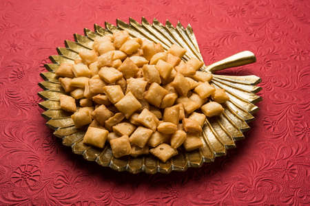 stock photo of  variety of Shakkar pare Also Know as Shakkarpare, Shakarpali, Shakkar Para, or Shankarpalli or shankar pale is a Snack Typically Made in India During Diwaliの写真素材