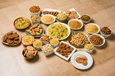 stock photo of  Diwali food or Diwali snacks or Diwali sweets like anarsa, bakarvadi, chakli, sev, bhujiya, shankar pale and chivda or chiwada, karanji, favourite indian diwali recipe, selective focusの写真素材