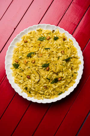 Cooked plain white basmati rice in terracotta bowl over plain or wooden background