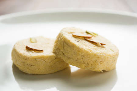 Stock photo of Soan Papdi or Soan roll or Patisa or patisha, popular sweet from India. selective...