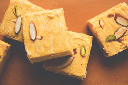 Stock photo of Soan Papdi or Soan roll or Patisa or patisha, popular sweet from India. selective...