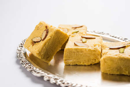 Stock photo of Soan Papdi or Soan roll or Patisa or patisha, popular sweet from India. selective...