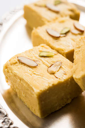 Stock photo of Soan Papdi or Soan roll or Patisa or patisha, popular sweet from India. selective...