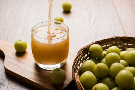 Indian fresh gooseberry juice or stock photo of Amla juice (Phyllanthus emblica) , selective focusの写真素材