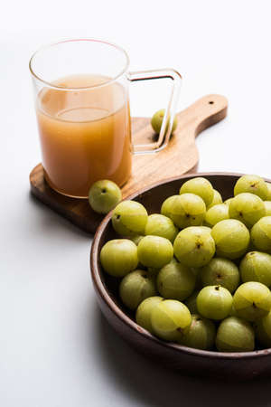 Indian fresh gooseberry juice or stock photo of Amla juice (Phyllanthus emblica) , selective focusの写真素材