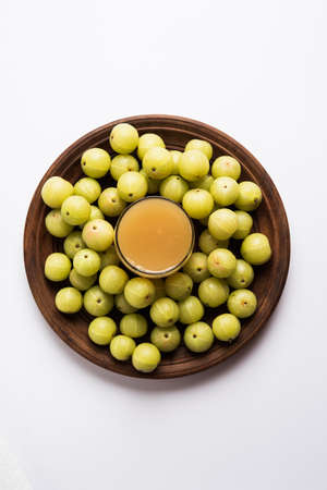 Indian fresh gooseberry juice or stock photo of Amla juice (Phyllanthus emblica) , selective focusの写真素材