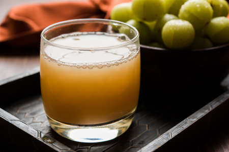 Indian fresh gooseberry juice or stock photo of Amla juice (Phyllanthus emblica) , selective focusの写真素材