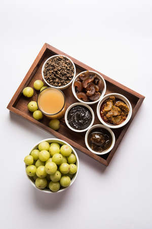 Stock photo of Amla/Avla/Aavla and it's by products like chyawanprash or chyavanprash, juice, Amla...