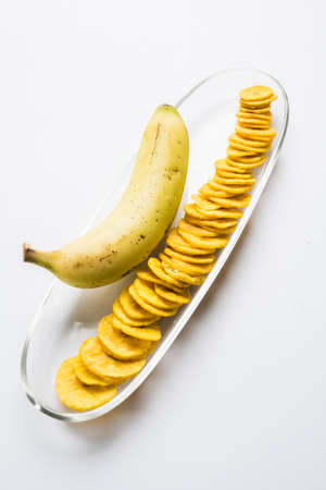 Stock Photo of Healthy Homemade Kela or Banana chips or wafers or Plantain Chips, selective focusの写真素材