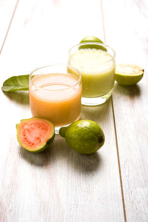 Guava  juice or Amrud drink or Smoothie with fresh Guava fruit, moody lighting selective focusの写真素材