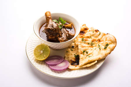 Mutton Masala Or Masala Gosht or indian lamb rogan josh with some seasoning, served with Naan or...
