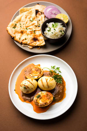 Anda Curry or Egg Curry or Egg masala gravy, indian spicy food or recipe, served with roti or naan,...