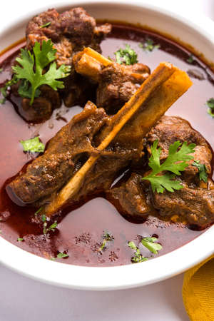 Mutton Masala Or Masala Gosht or indian lamb rogan josh with some seasoning, served with Naan or Roti, selective focusの写真素材