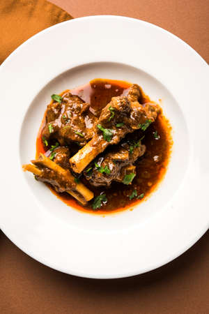 Mutton Masala Or Masala Gosht or indian lamb rogan josh with some seasoning, served with Naan or Roti, selective focusの写真素材