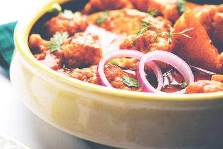 Aloo Gobi matar is a famous Indian curry dish with potatoes and cauliflower and green peas, selective focusの写真素材