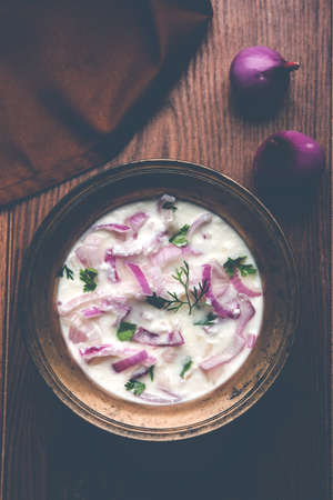 Onion Raita / pyaj or kanda Koshimbir / Indian salad is a condiment from the Indian subcontinent,...