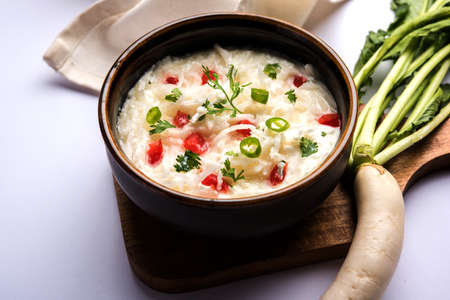 Radish Raita / daikon or Mooli Koshimbir is a condiment from the Indian subcontinent, made with dahi or curd together with raw or cooked vegetables like radish, tomato, green chilli and corianderの写真素材