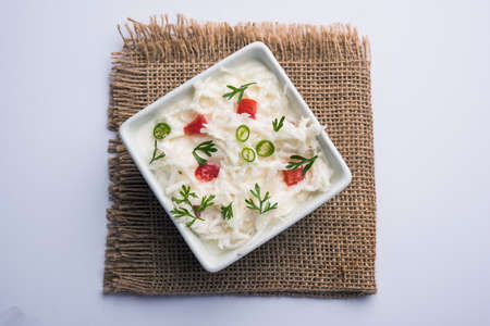Radish Raita / daikon or Mooli Koshimbir is a condiment from the Indian subcontinent, made with dahi or curd together with raw or cooked vegetables like radish, tomato, green chilli and corianderの写真素材
