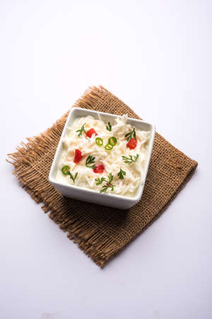 Radish Raita / daikon or Mooli Koshimbir is a condiment from the Indian subcontinent, made with dahi or curd together with raw or cooked vegetables like radish, tomato, green chilli and corianderの写真素材
