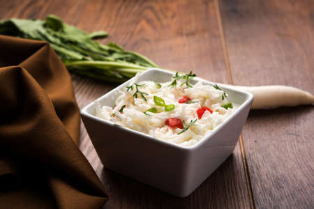 Radish Raita / daikon or Mooli Koshimbir is a condiment from the Indian subcontinent, made with dahi or curd together with raw or cooked vegetables like radish, tomato, green chilli and corianderの写真素材