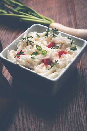 Radish Raita / daikon or Mooli Koshimbir is a condiment from the Indian subcontinent, made with dahi or curd together with raw or cooked vegetables like radish, tomato, green chilli and corianderの写真素材