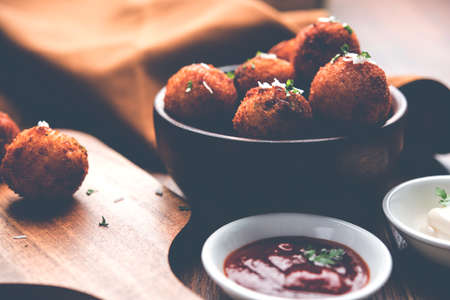Fried potato cheese balls or croquettes with tomato ketchup. Selective focusの写真素材