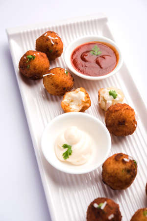 Fried potato cheese balls or croquettes with tomato ketchup. Selective focusの写真素材
