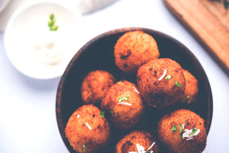 Fried potato cheese balls or croquettes with tomato ketchup. Selective focus