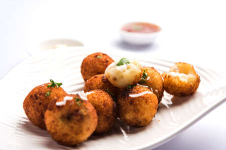 Fried potato cheese balls or croquettes with tomato ketchup. Selective focusの写真素材