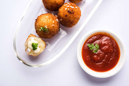 Fried potato cheese balls or croquettes with tomato ketchup. Selective focusの写真素材