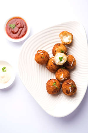 Fried potato cheese balls or croquettes with tomato ketchup. Selective focusの写真素材
