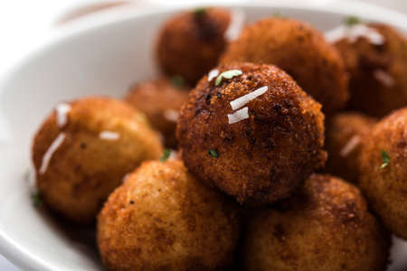 Fried potato cheese balls or croquettes with tomato ketchup. Selective focus