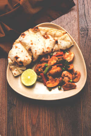 Indian mushroom curry with roti or naan or flat bread, selective focusの写真素材