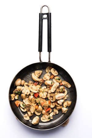 Mushroom Fry or sauteed mushroom or masharoom served in a bowl or in a frying pan over colourful...