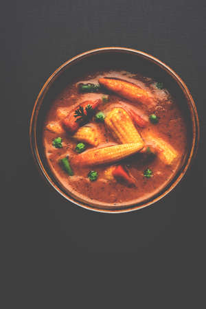 Indian Baby Corn Masala or spicy Baby corn curry served with roti or naan or indian breadの写真素材