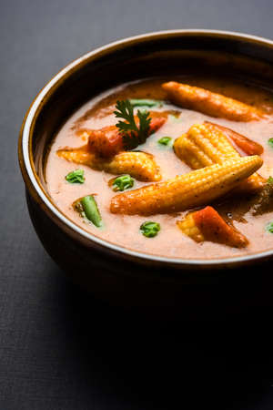 Indian Baby Corn Masala or spicy Baby corn curry served with roti or naan or indian breadの写真素材