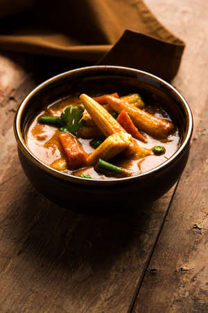 Indian Baby Corn Masala or spicy Baby corn curry served with roti or naan or indian breadの写真素材