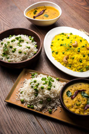 group photo of indian rice with green peas and garlic served with jeera dal fry, selective focusの写真素材
