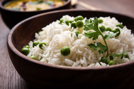 Basmati Rice Pilaf or pulav with Peas, or vegetable rice using green peas also known as matar pulav,...