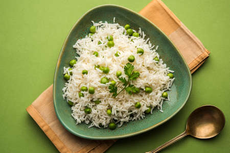 Basmati Rice Pilaf or pulav with Peas, or vegetable rice using green peas also known as matar pulav, served with plain dalの写真素材