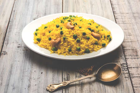 Basmati Rice Pilaf or pulav with Peas, or vegetable rice using green peas also known as matar pulav,...