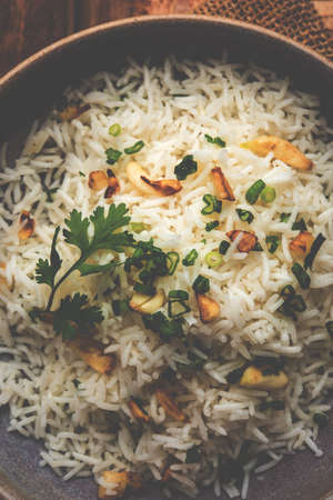 Garlic fried rice - cooked white basmati rice fried with garlic and served with yellow dal, popular indian recipeの写真素材