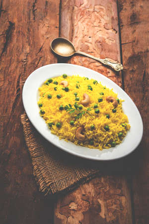Basmati Rice Pilaf or pulav with Peas, or vegetable rice using green peas also known as matar pulav,...