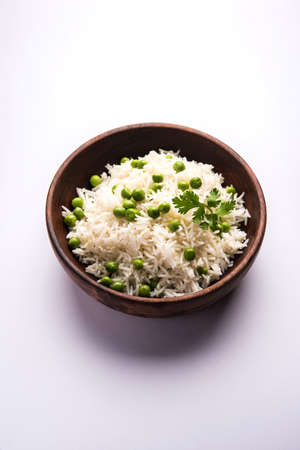 Basmati Rice Pilaf or pulav with Peas, or vegetable rice using green peas also known as matar pulav, served with plain dalの写真素材